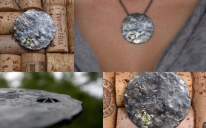 Steel, peridot and gold leaf (planet?) pendant