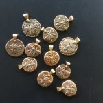 Sand-cast bronze bee pendants with silver rivets